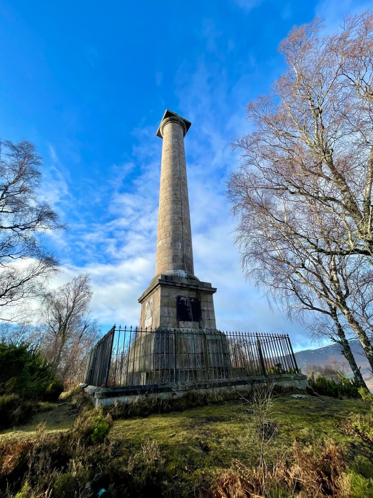 Large monument with fence all around 