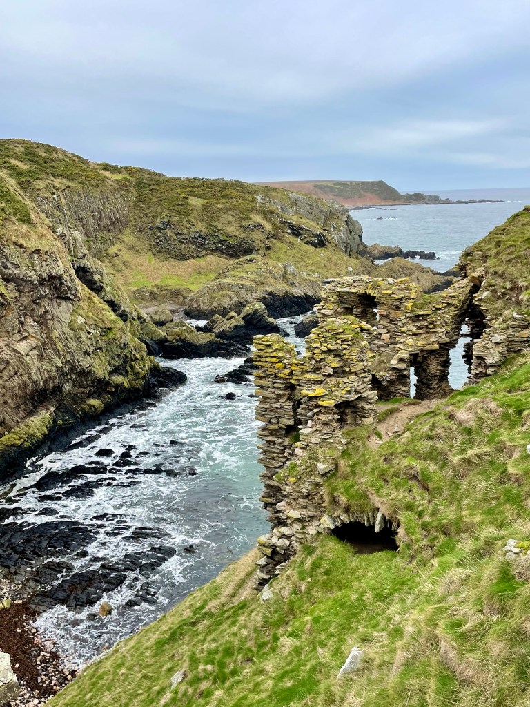 Castle ruins with sea to left hand side 