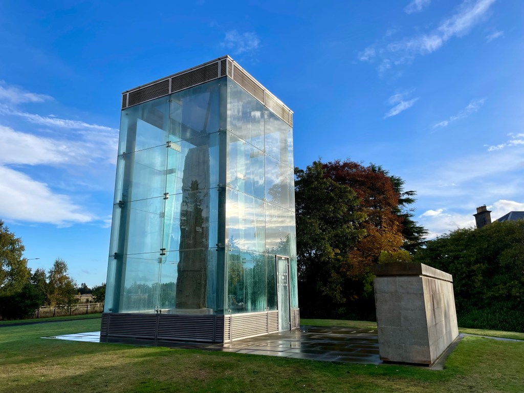 Large stone in glass case 